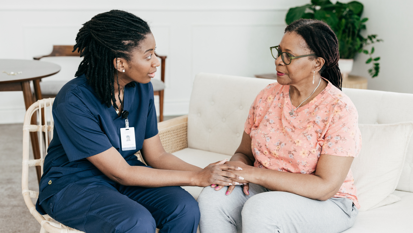 health worker sitting next to patient