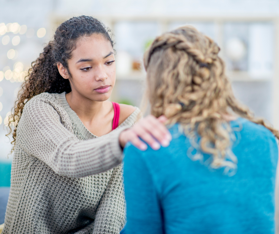 woman comforting friend